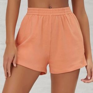 From Shein cute comfortable orange short’s they are a size XS never worn